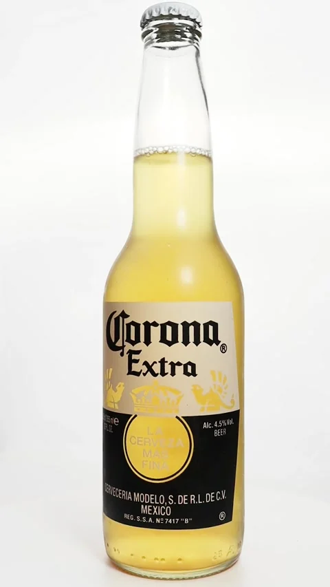 Bottle of Corona Extra beer rotating isolated on white background Stock Footage 329955037