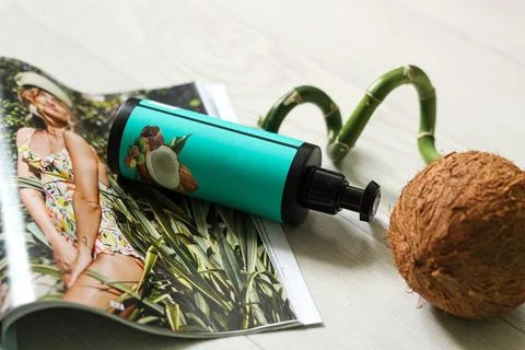 A bottle with a cosmetic in the decor Stock Photos