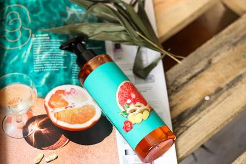 A bottle with a cosmetic in the decor Stock Photos