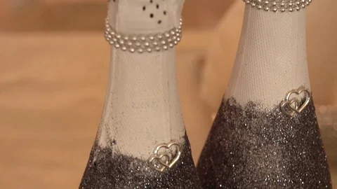 A bottle decorated on a table with artificial flowers decorated by a florist Stock Footage 122999720