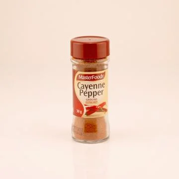 Bottle Of Dried Cayenne Pepper Stock Photos