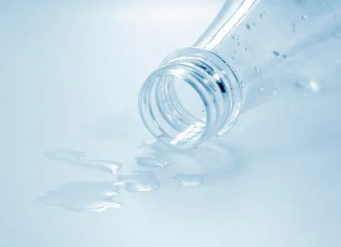Bottle with drops of water Stock Photos