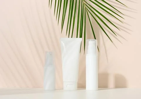 Bottle, empty white plastic tubes for cosmetics. Packaging for cream, gel, .. Stock Photos