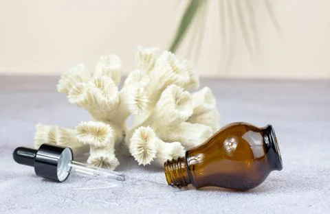 Bottle for essential oils and cosmetics. Brown cosmetic bottle Stock Photos