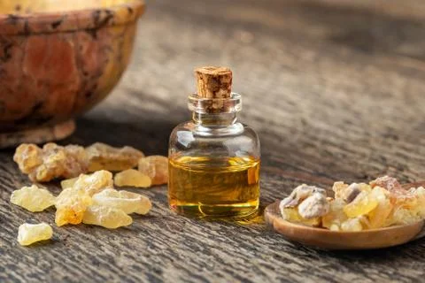A bottle of frankincense essential oil with frankincense resin Stock Photos
