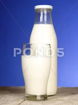 Bottle With Fresh Milk And Glass On The Table