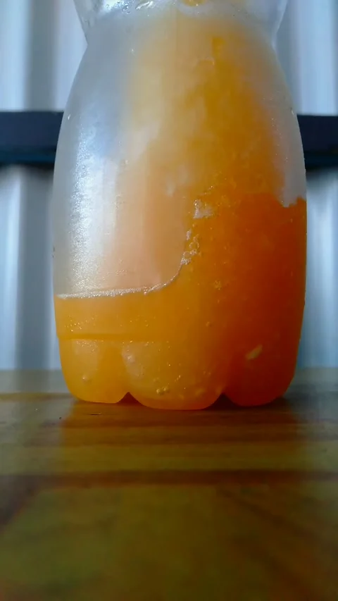 A Bottle of Fresh Orange Drink Stock Footage 156013024