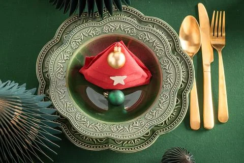 Bottle green dining table adorned with trimmings. Stock Photos