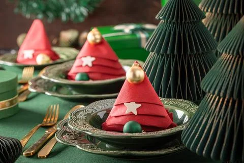 Bottle green table layout decorated with ornaments. Stock Photos