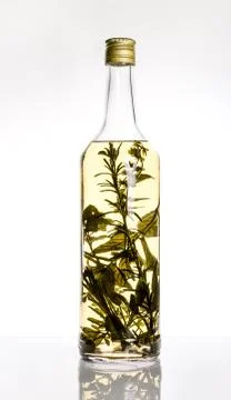 Bottle with healing herbs inside. Mint, sage, thyme. The concept of health. Stock Photos