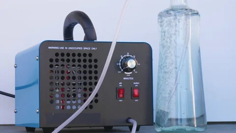 Bottle of iced water being ozonated with a round ozonating stone. Tubes leadi 스톡 동영상 143653053