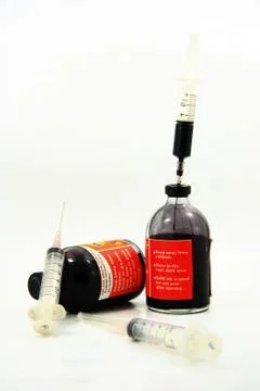 Bottle ink and syringe for printer Stock Photos