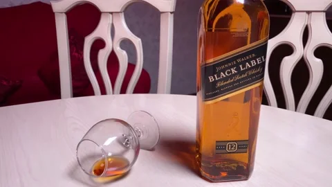 Bottle of Johnnie Walker Black LabelPerm, RUSSIA, 22 June 2021. Video stock 156536240
