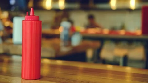 A bottle of ketchup on the background of a busy cafe. Stock Footage 191531765