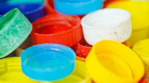 Bottle lids tracking shot plastic waste macro Stock Footage 115203641