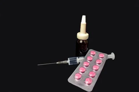 Bottle for medication syringe and blister tablets on gray background 스톡 사진
