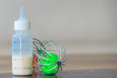 Bottle of milk for animals on the table Stock Photos