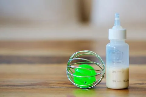 Bottle of milk for animals on the table Stock Photos