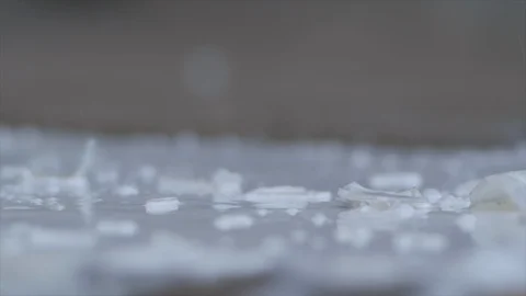 Bottle of Milk Splashes onto the Ground in the Rain HD Video Stock Footage 92086795