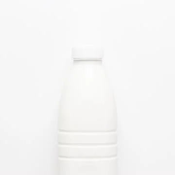 Bottle of milk on white background Stock Photos