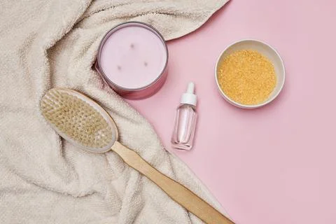 A bottle of moisturizer and a wooden diffuser Stock Photos