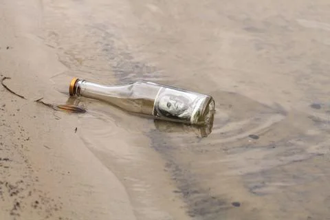Bottle with money Stock Photos