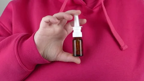A bottle of nasal drops in your hand. Stock Footage 333780091
