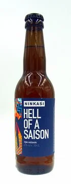 Bottle of Ninkasi Hell of a Saison beer Stock Photos