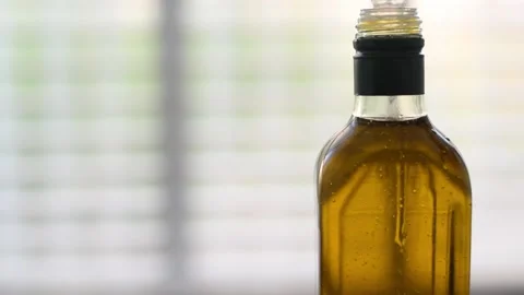 Bottle of oil on light white background. Stock Footage 184831791