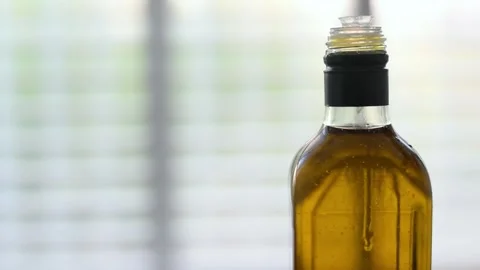 Bottle of oil on light white background. Stock Footage 184832030