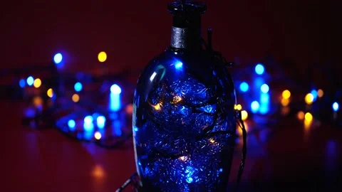 Bottle with a pattern and multi-colored flashing lights Stockbeeldmateriaal 168411592