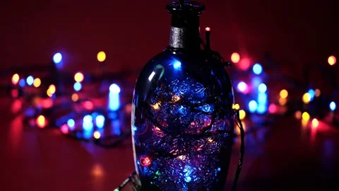 Bottle with a pattern and multi-colored flashing lights Stock Footage 168412074