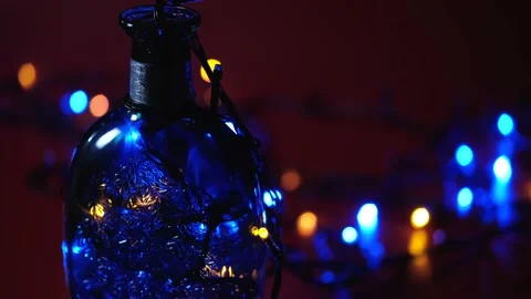 Bottle with a pattern and multi-colored flashing lights Stock Footage 168412223