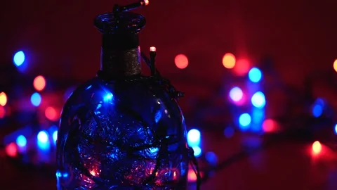 Bottle with a pattern and multi-colored fast blinking lights and flashes Stock-Footage 168412324