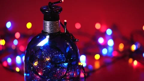 Bottle with a pattern and multi-colored fast flashing lights Stockbeeldmateriaal 168412337