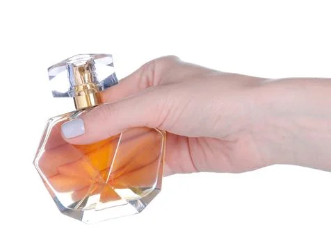 Bottle of perfume in hand Stock Photos
