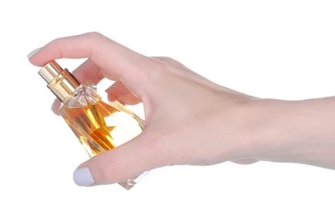 Bottle of perfume in hand Stock Photos