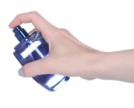 Bottle of perfume in hand Stock Photos