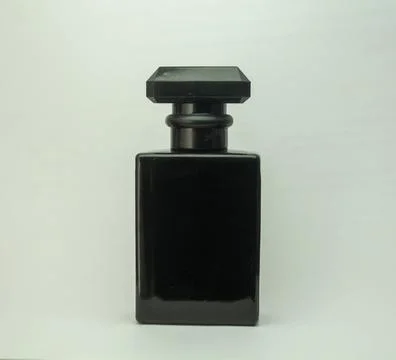 Bottle of perfume on white background Stock Photos