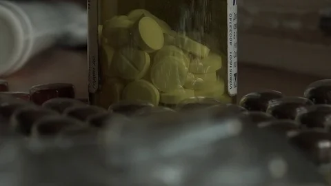 Bottle of pills and an empty pack of pills. Video stock 75194242