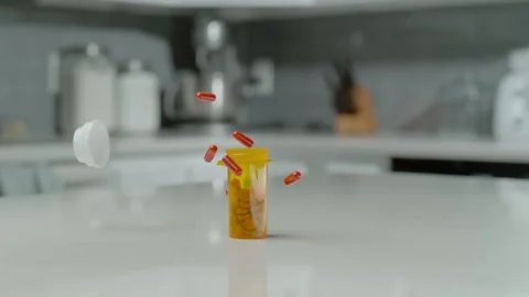 Bottle of Pills fall on table Video stock 247091838