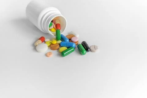 Bottle with pills on a white background. Stock Photos
