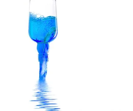 Bottle pouring blue liquid Stock Photos