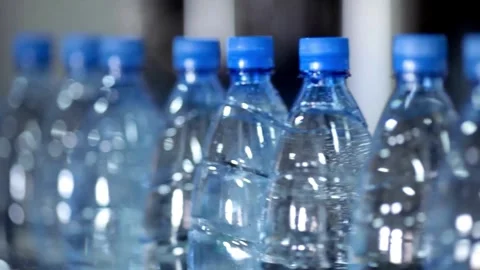 Bottle with pure Clean water in plastic bottle moves through conveyor factory. Stock Footage 334587839