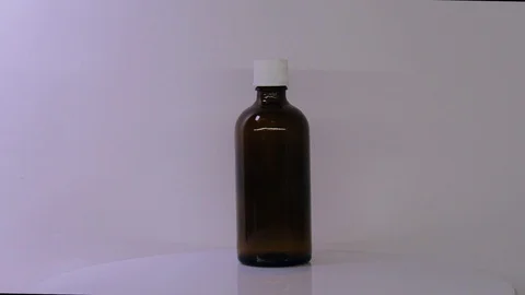 Bottle in ray of light Stock Footage 129607219