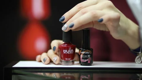 Bottle of red lacquer brand Wula Stock Footage 101777779