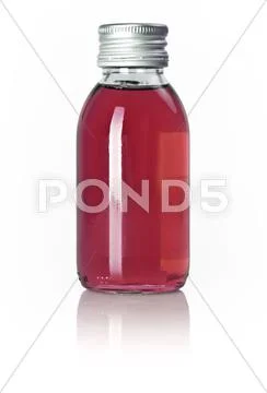 Bottle of red liquid Stock Photos