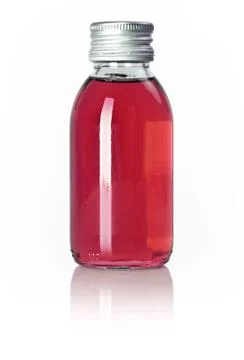 Bottle of red liquid Stock Photos