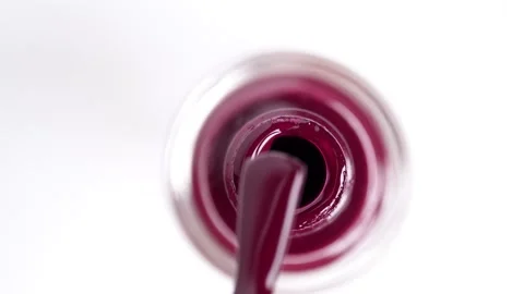 Bottle of red nail polish with brush. Nail polish brush with red enamel. Da.. Stock Footage 256156643