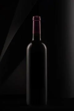 Bottle of red wine on a black background Stock Photos